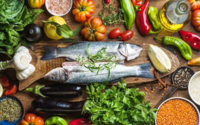 A selection of Mediterranean foods such a fish, fruit and vegetables